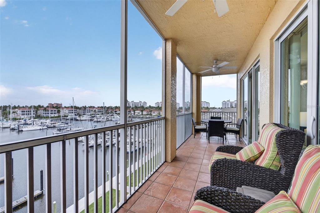 2060 Matecumbe Key Road, Unit 2506 Punta Gorda, FL 33955 - Photo 28 of 38 a balcony with furniture and a floor to ceiling window
