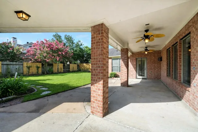 a view of a pathway with a backyard