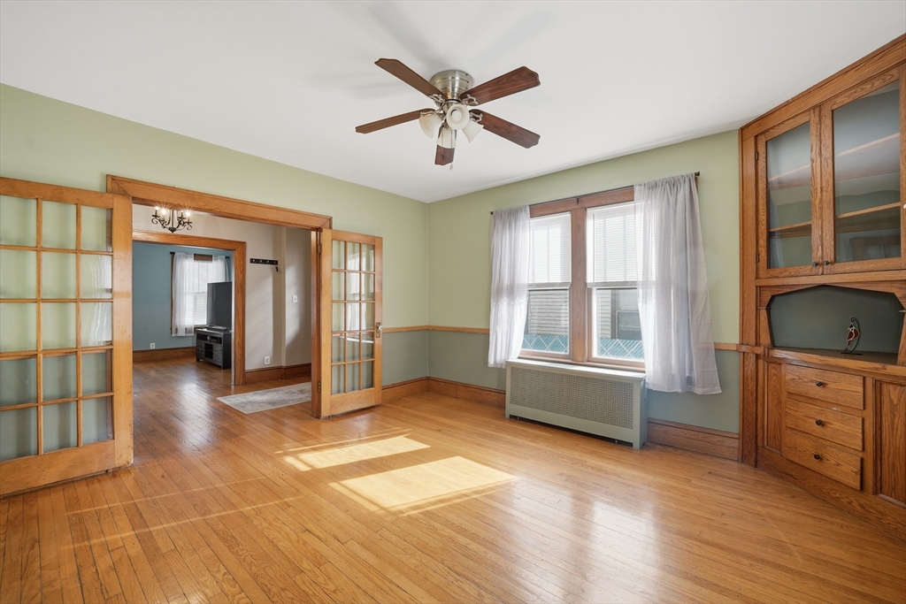 572 Springfield Street Chicopee, MA 01013 - Photo 14 of 42 a view of livingroom with hardwood floor and ceiling fan