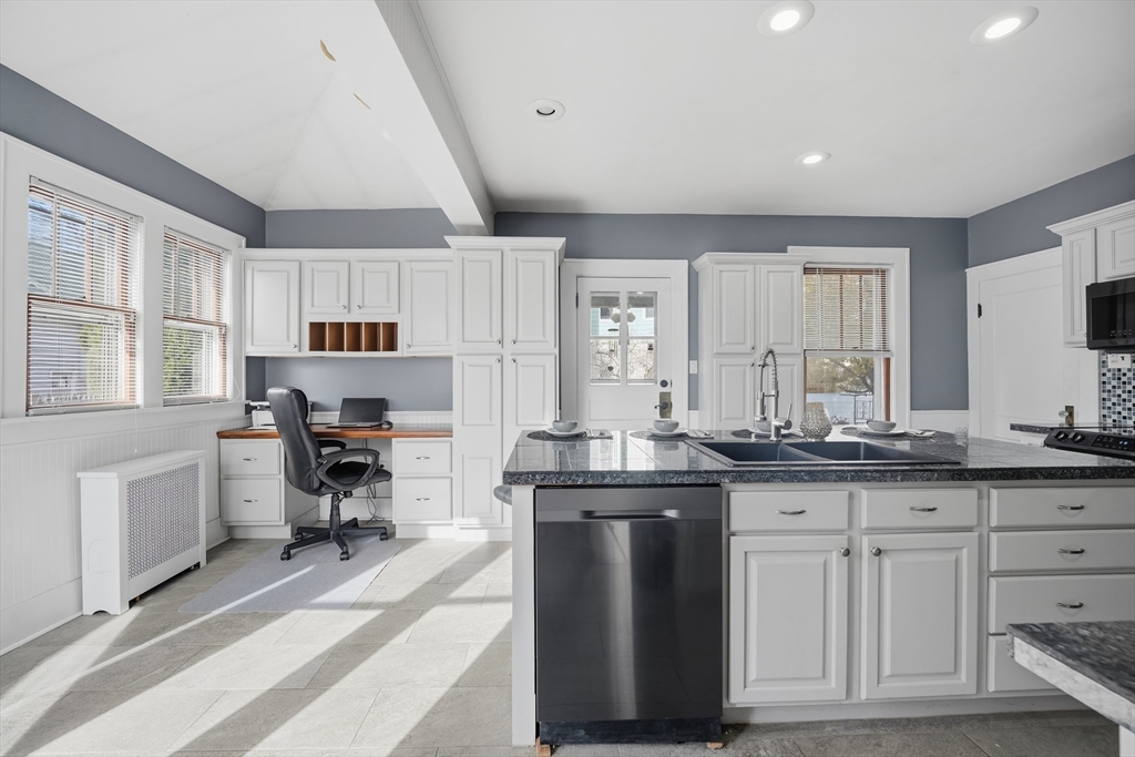 572 Springfield Street Chicopee, MA 01013 - Photo 15 of 42 a kitchen with granite countertop a sink and cabinets