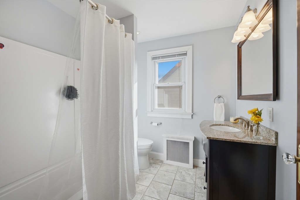 572 Springfield Street Chicopee, MA 01013 - Photo 28 of 42 a bathroom with a sink and a mirror