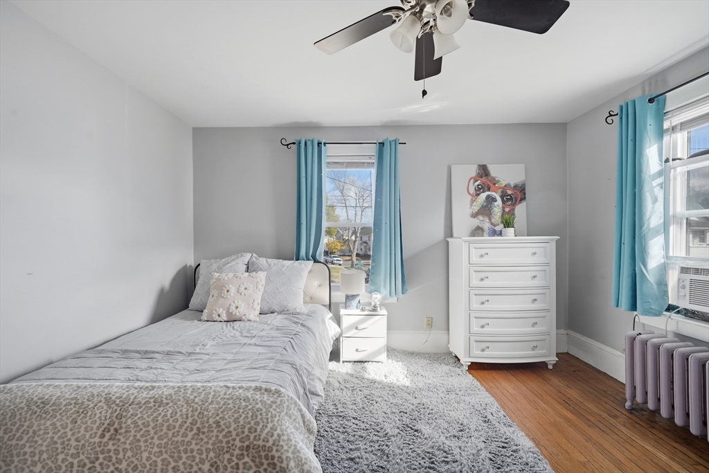 572 Springfield Street Chicopee, MA 01013 - Photo 31 of 42 a bedroom with a bed and a window