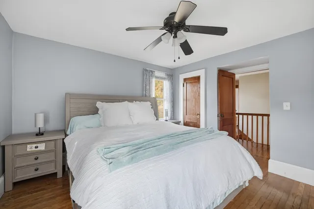 a bedroom with a large bed and a tv