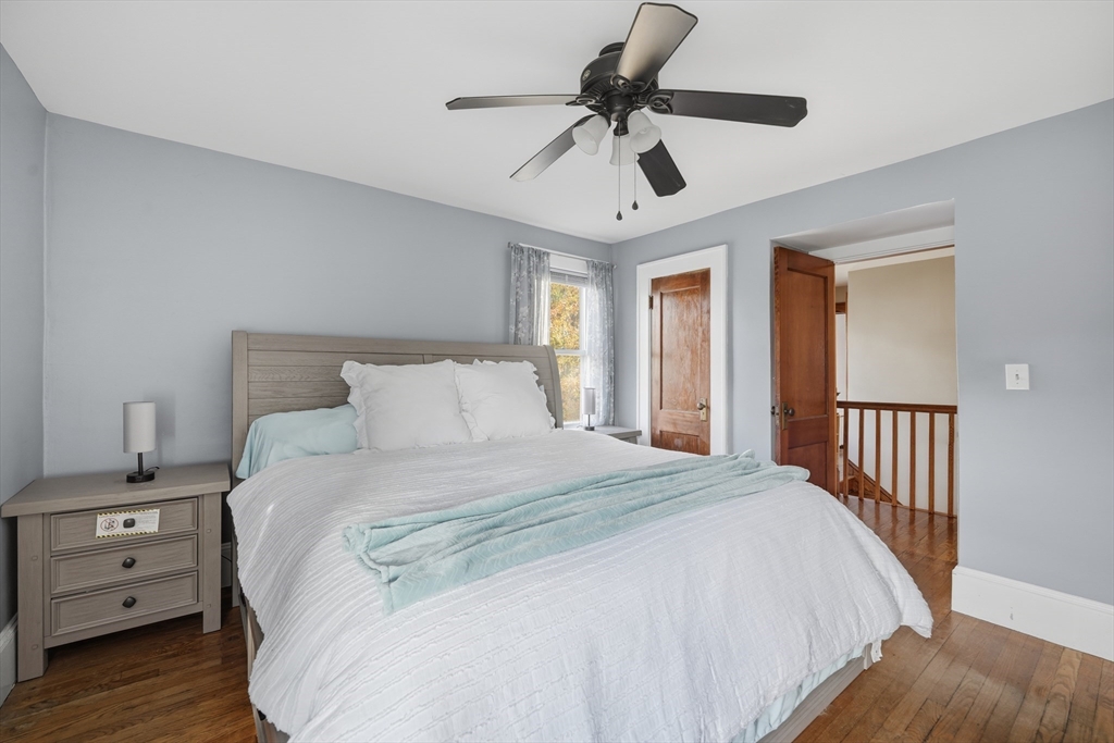 572 Springfield Street Chicopee, MA 01013 - Photo 33 of 42 a bedroom with a large bed and a tv