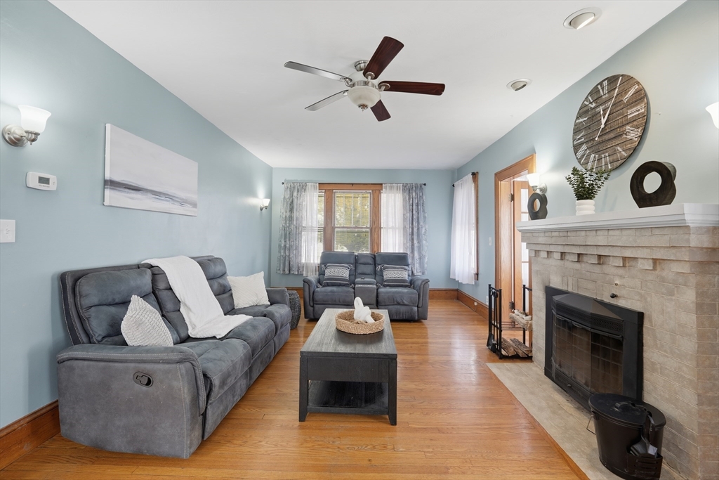 572 Springfield Street Chicopee, MA 01013 - Photo 7 of 42 a living room with furniture and a fireplace