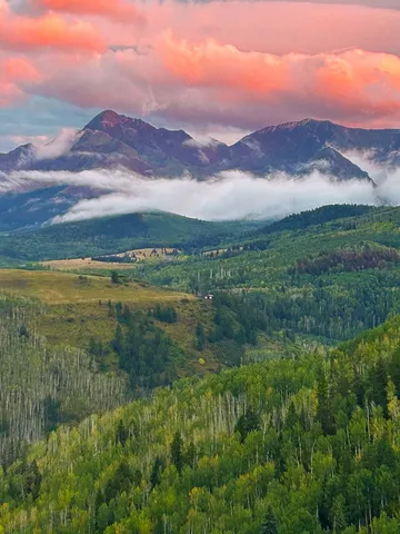 a view of a lake with sunset