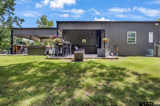a view of a swimming pool with a patio