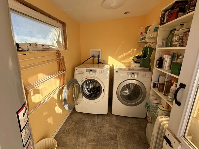 a kitchen with a stove a sink and a microwave