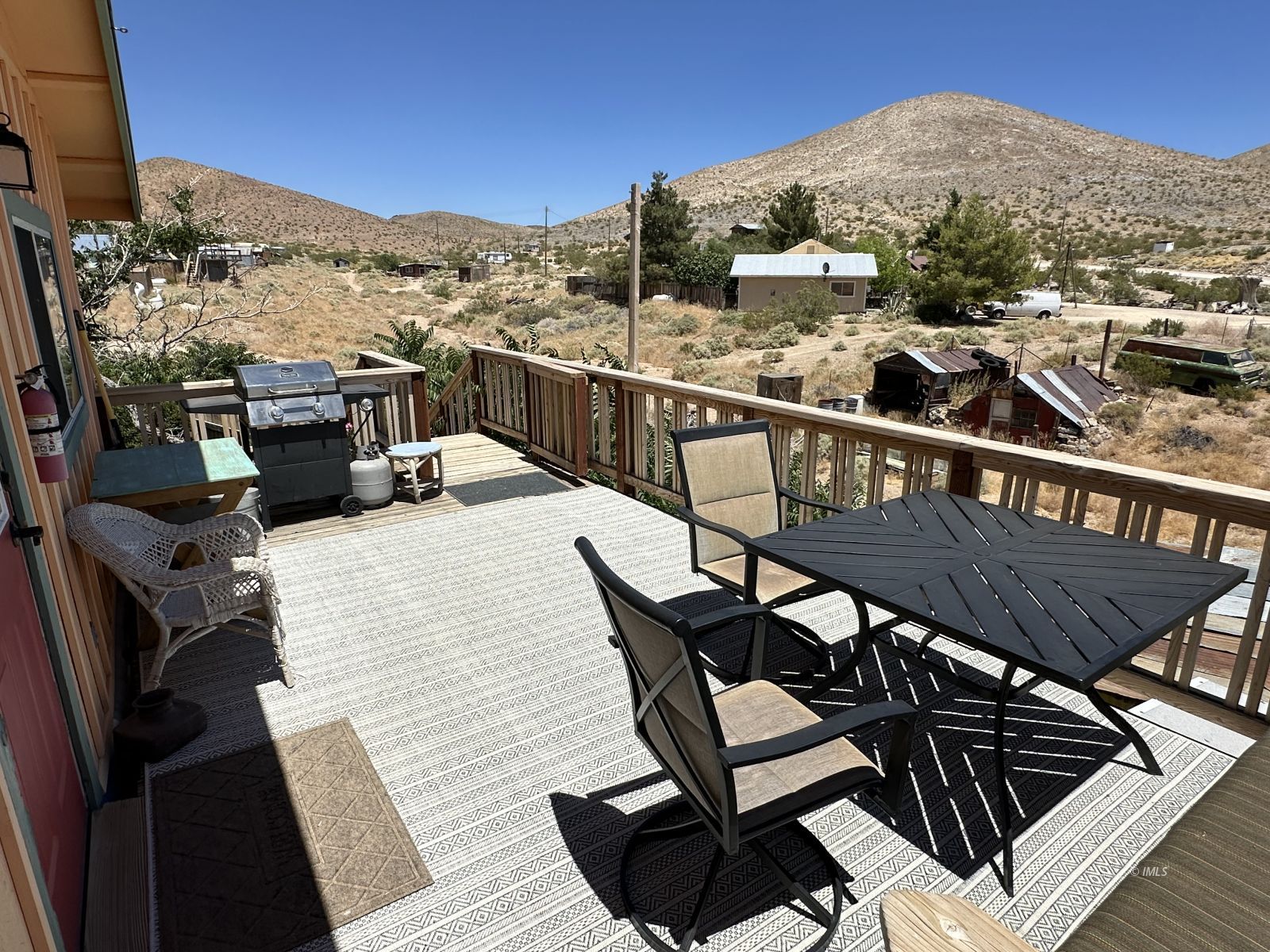 220 East Fulton Street Darwin, CA 93522 - Photo 23 of 34 a view of a balcony dining table and chairs