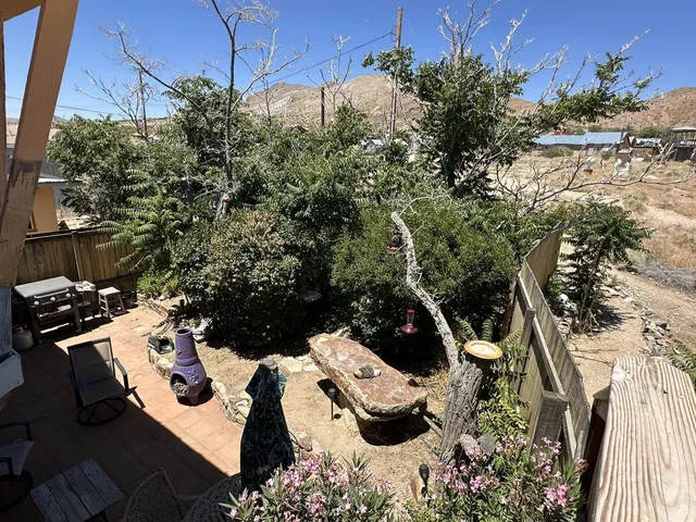 a view of a chairs and table in a patio