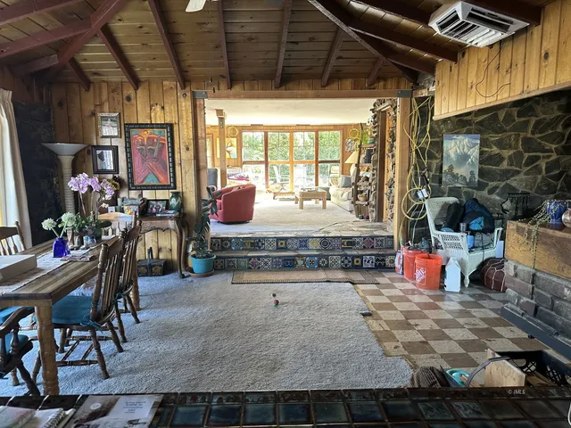 a room with lots of furniture and windows