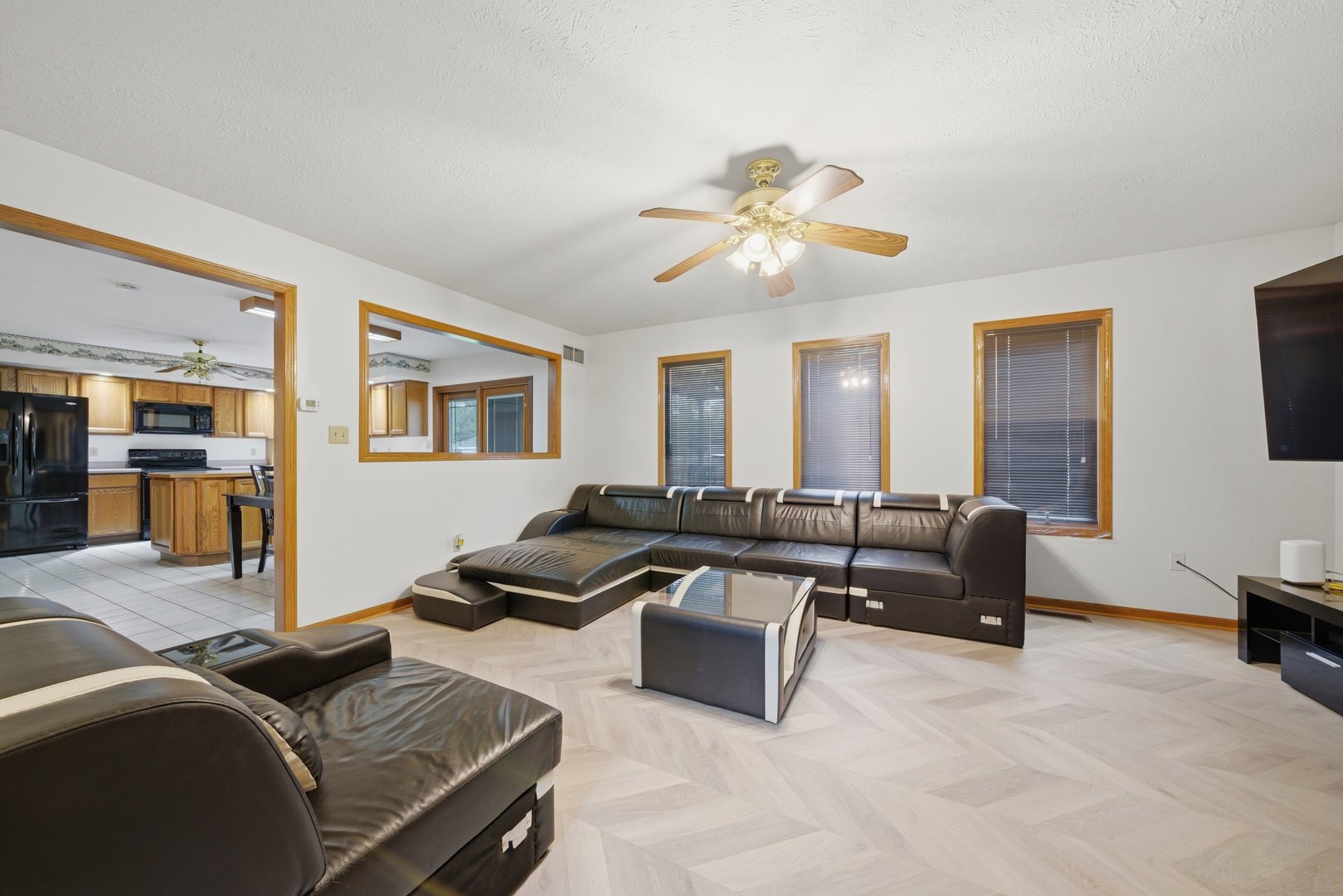 1016 North 7th Street Rochelle, IL 61068 - Photo 12 of 39 a living room with furniture ceiling fan and a wooden floor