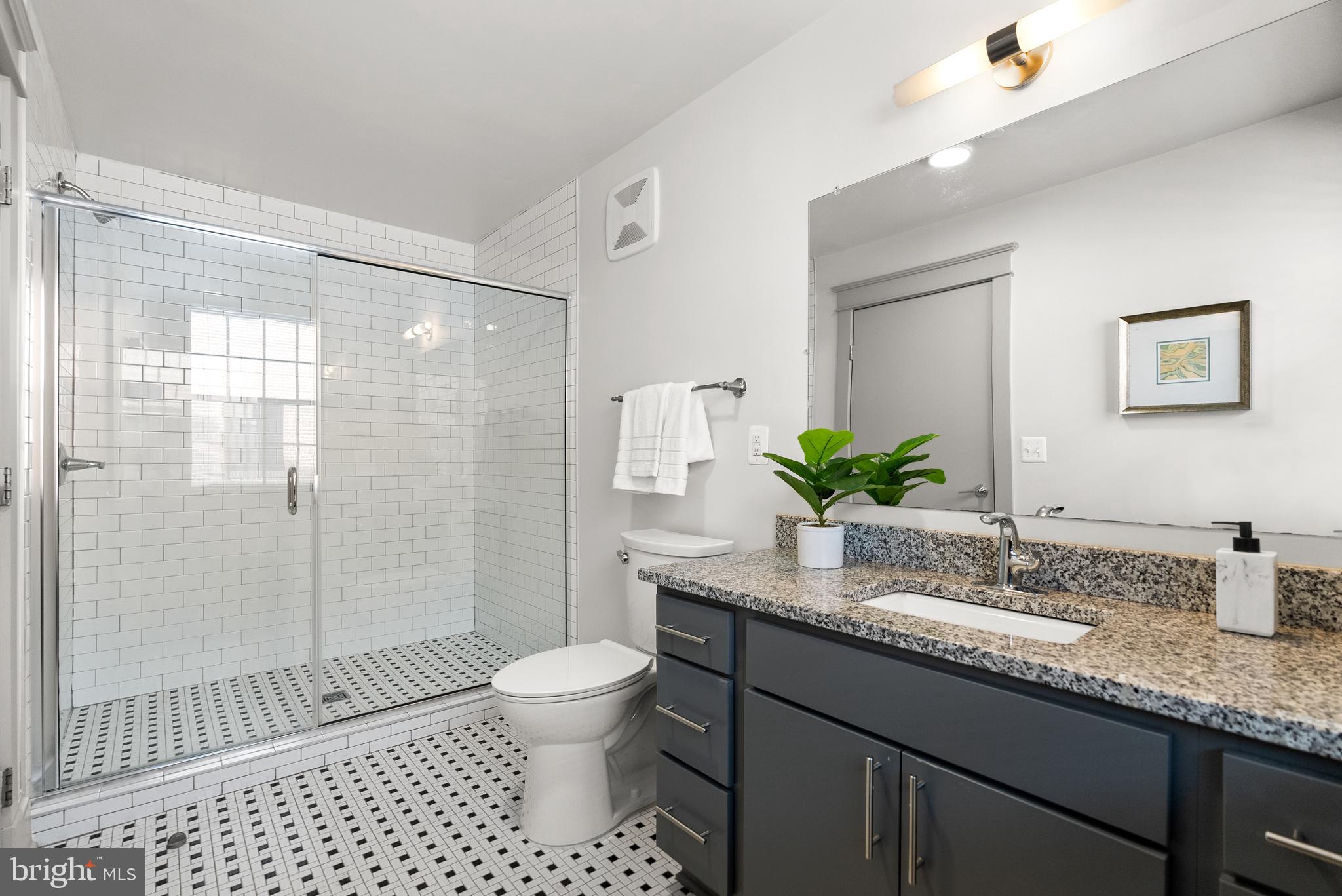 9071 Power House Road, Unit 103 Lorton, VA 22079 - Photo 18 of 48 The en-suite bathroom with a large vanity.