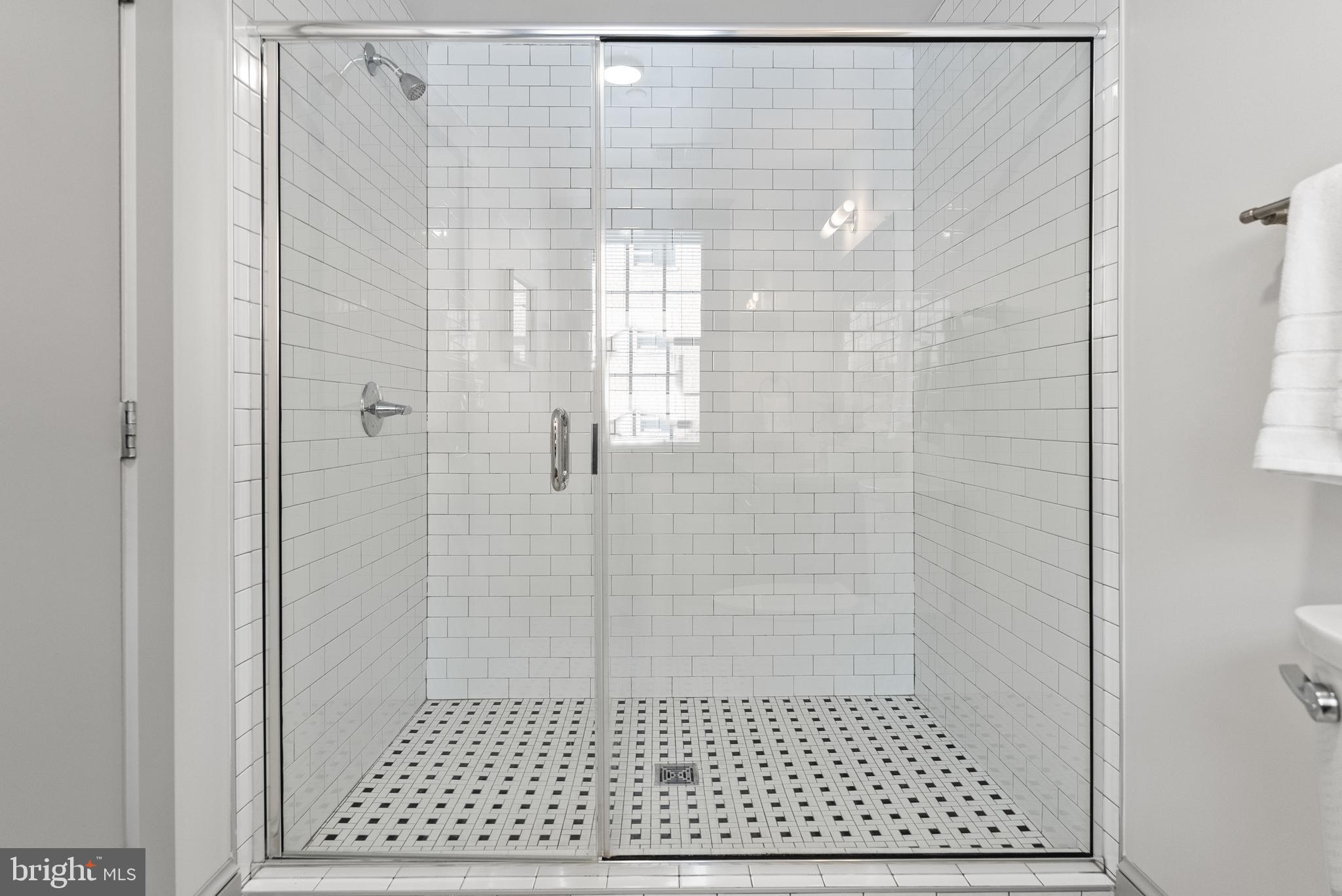 9071 Power House Road, Unit 103 Lorton, VA 22079 - Photo 20 of 48 Generously proportioned walk-in glass shower.