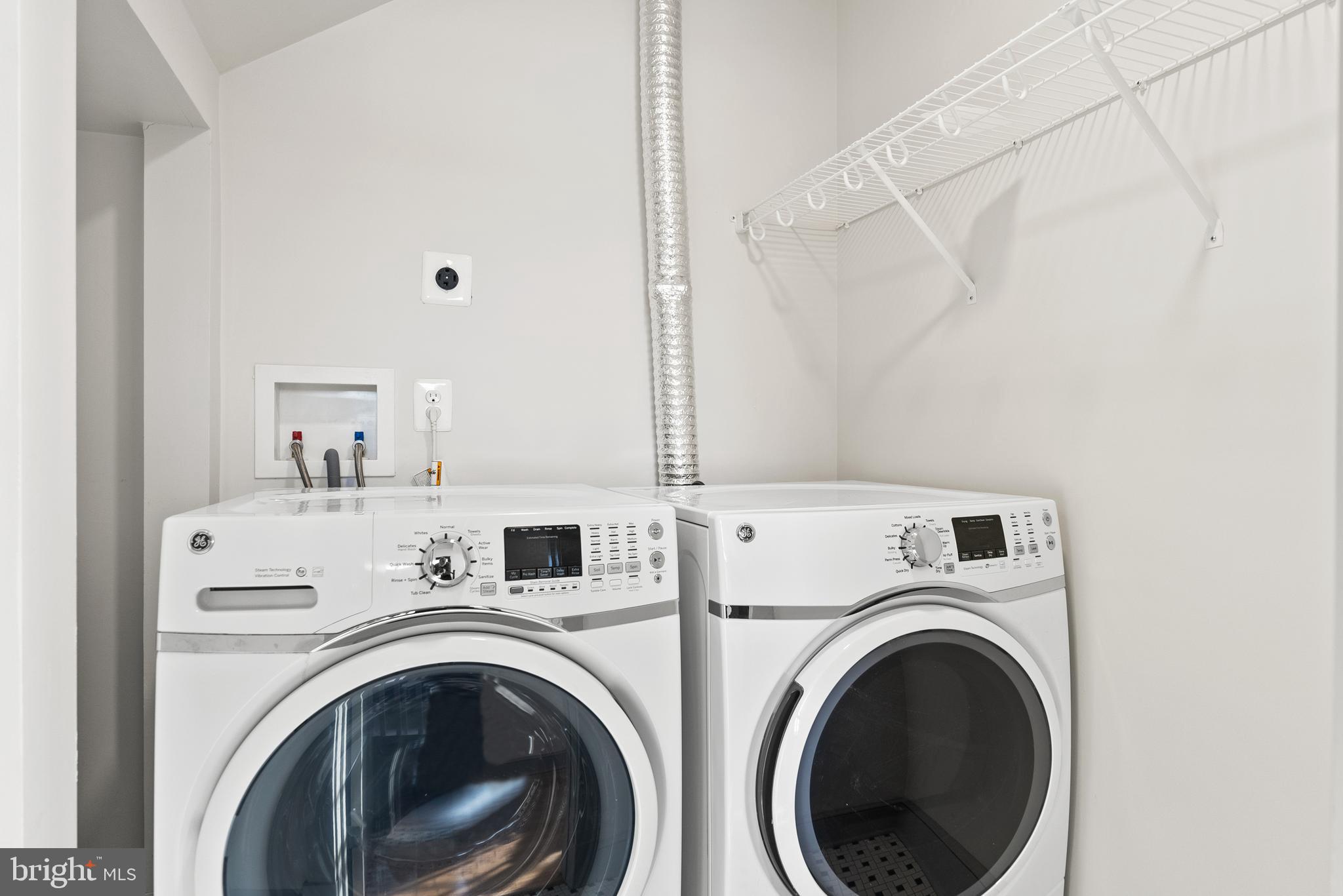9071 Power House Road, Unit 103 Lorton, VA 22079 - Photo 23 of 48 Laundry room with front-loading appliances.