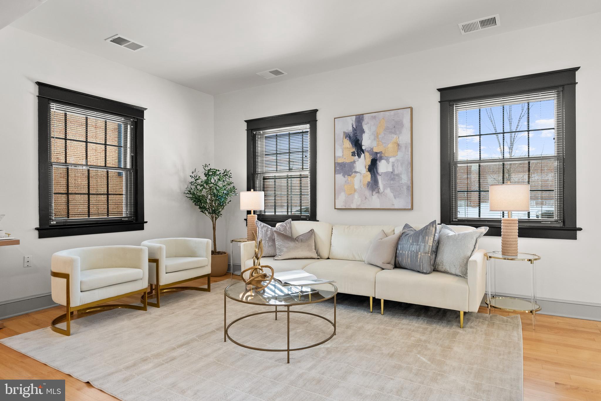 9071 Power House Road, Unit 103 Lorton, VA 22079 - Photo 5 of 48 Gather with friends in the large living room.