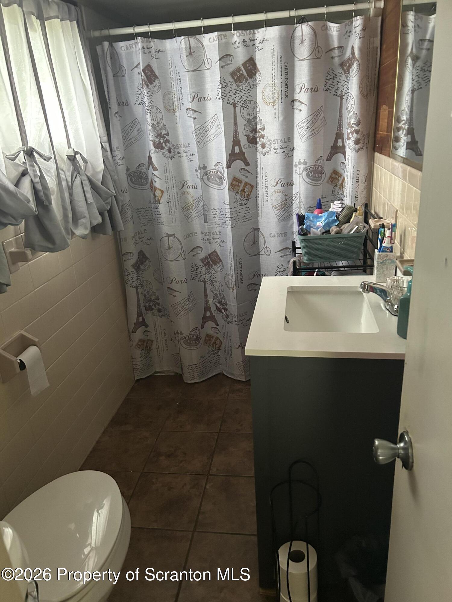 63 Shannon Street Simpson, PA 18407 - Photo 15 of 24 a bathroom with a sink toilet and shower