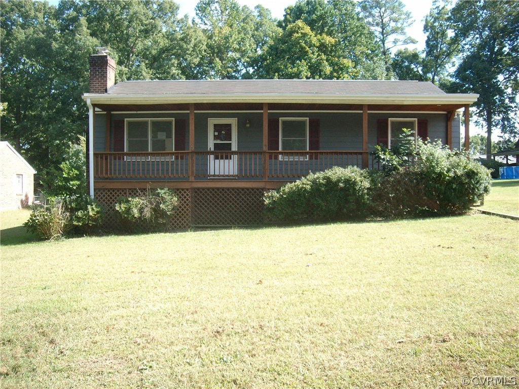 3301 Sylvania Road Chester, VA 23831 - Photo 1 of 13 a front view of house with yard and trees around