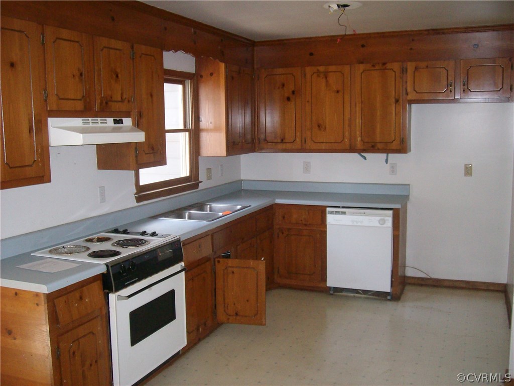3301 Sylvania Road Chester, VA 23831 - Photo 5 of 13 a kitchen with stainless steel appliances granite countertop a stove a sink and a microwave