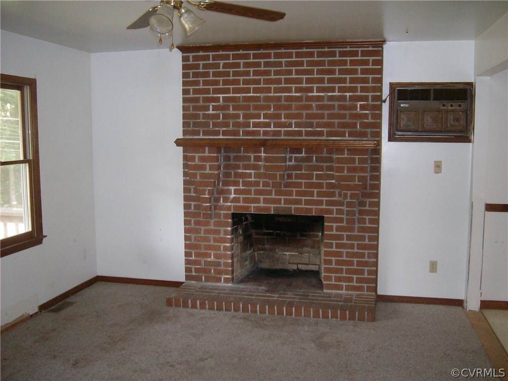 3301 Sylvania Road Chester, VA 23831 - Photo 6 of 13 a living room with a fireplace