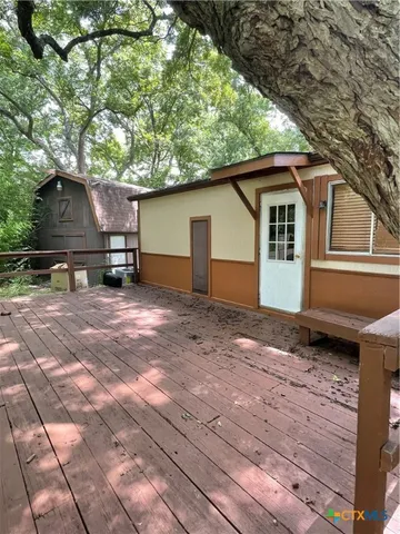 a backyard of a house with yard and outdoor seating