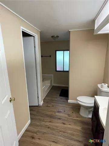 a bathroom with a sink and toilet