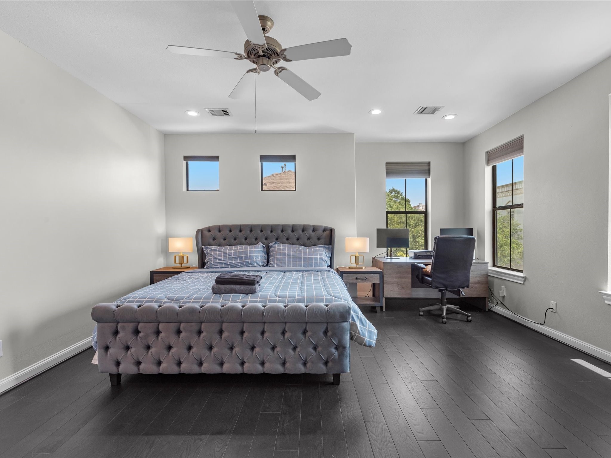 3610 Chenevert Street Houston, TX 77004 - Photo 17 of 32 Experience the elegance of the expansive primary bedroom, featuring soaring ceilings for an airy and inviting atmosphere.