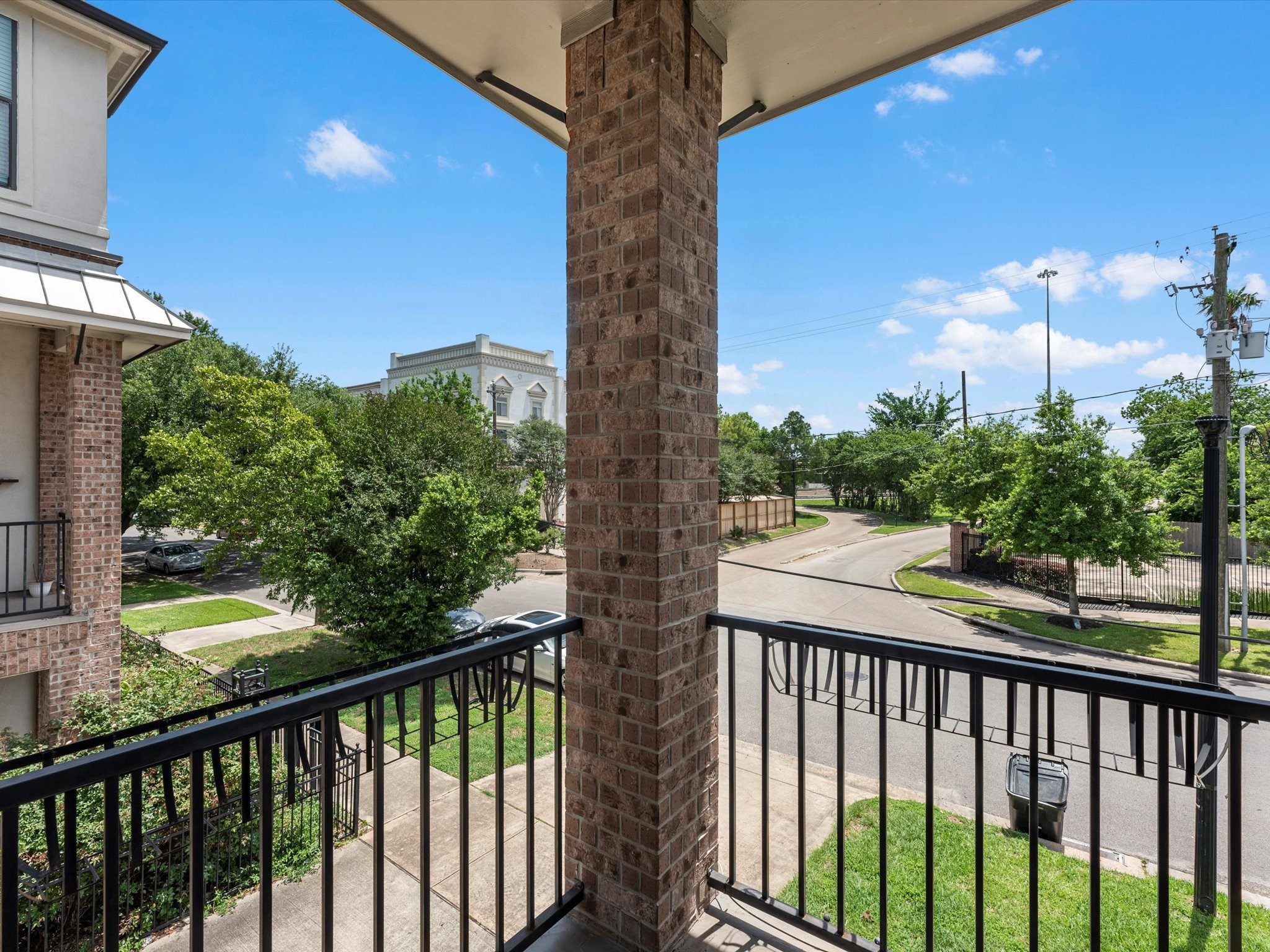 3610 Chenevert Street Houston, TX 77004 - Photo 29 of 32 Enjoy easy access to the second-floor balcony right from the living room.