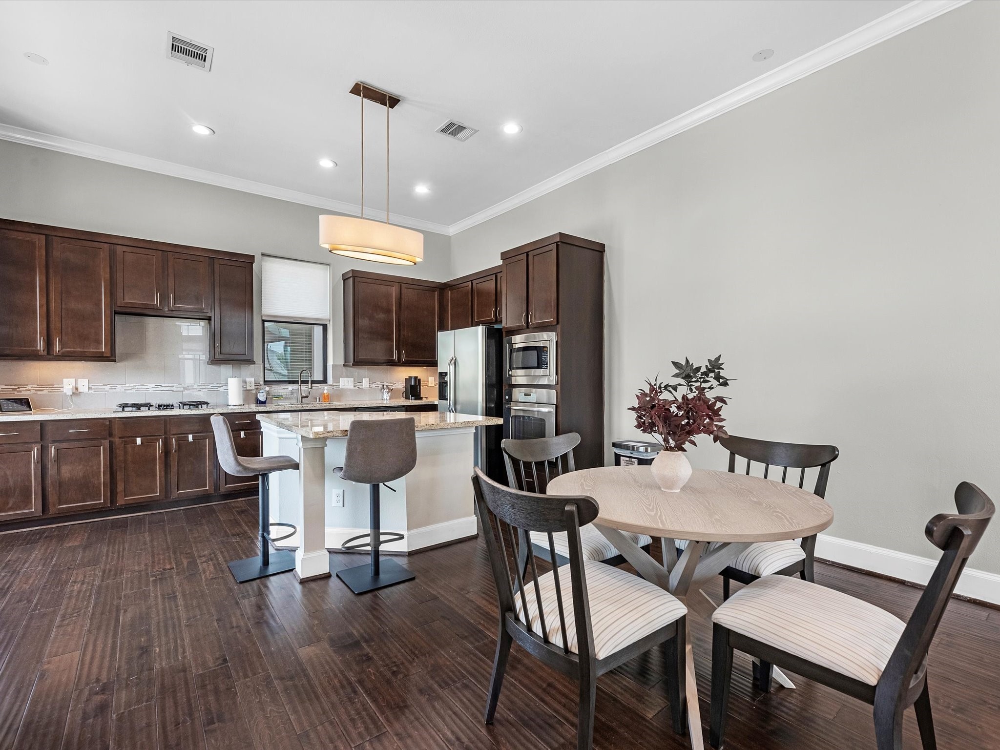 3610 Chenevert Street Houston, TX 77004 - Photo 10 of 32 An elegant open-concept dining area seamlessly connects to the kitchen and living room.