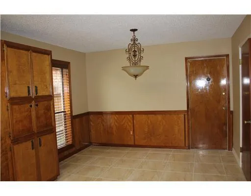 a view of empty room with a window