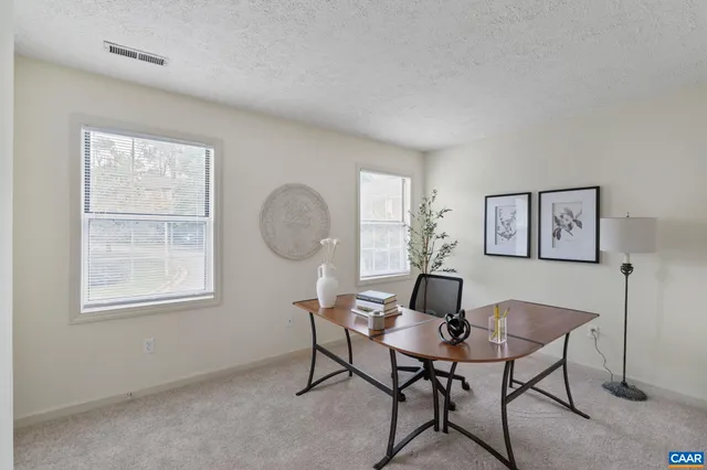 a workspace with furniture and window