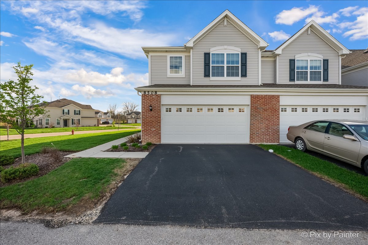 8508 Stillwater Road Wonder Lake, IL 60097 - Photo 2 of 37 a front view of a house with a yard