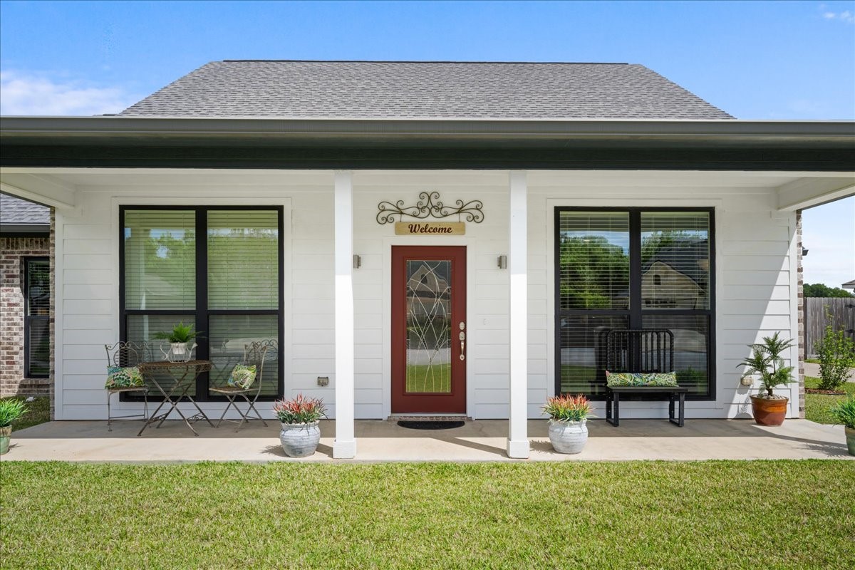 a front view of a house with a porch