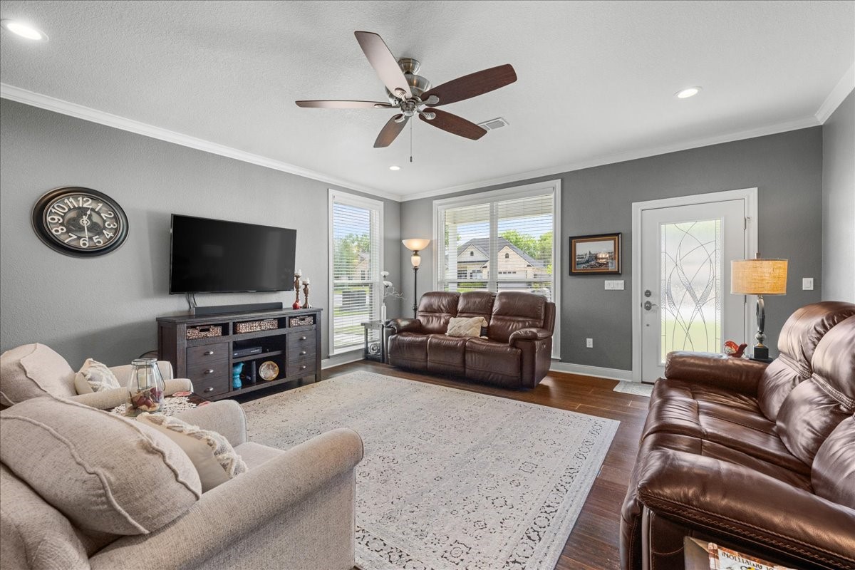 1207 Pecan Street Brenham, TX 77833 - Photo 11 of 29 a living room with furniture and a flat screen tv