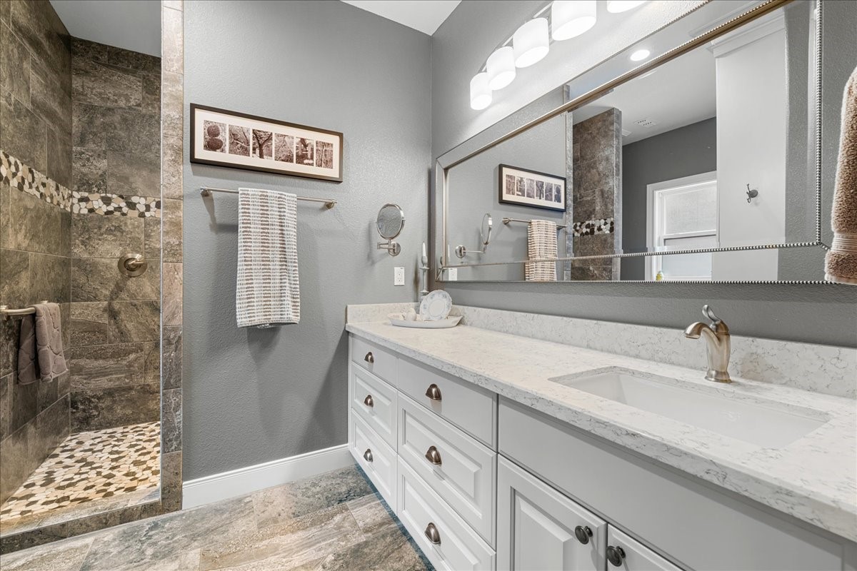 1207 Pecan Street Brenham, TX 77833 - Photo 15 of 29 a bathroom with a sink and a mirror