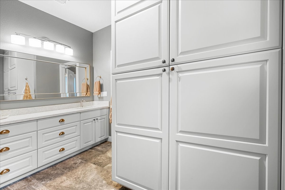 1207 Pecan Street Brenham, TX 77833 - Photo 16 of 29 a view of a closet with cabinet in it