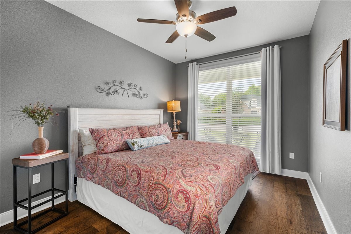 1207 Pecan Street Brenham, TX 77833 - Photo 18 of 29 a bedroom with a large bed and a window