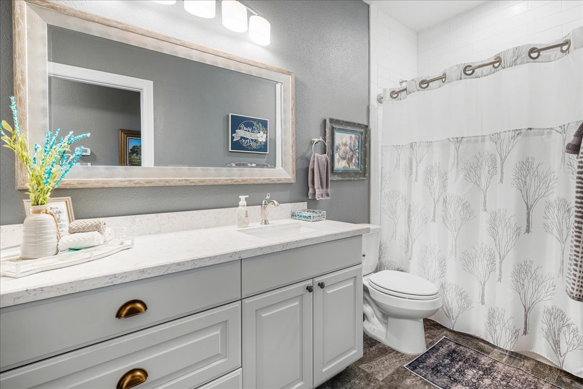 1207 Pecan Street Brenham, TX 77833 - Photo 19 of 29 a bathroom with a sink and a mirror