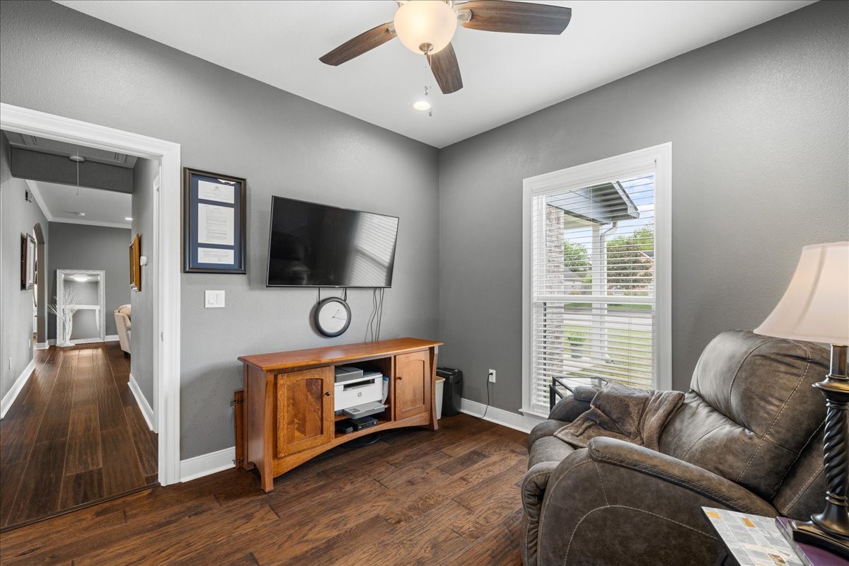 1207 Pecan Street Brenham, TX 77833 - Photo 20 of 29 a living room with furniture and a flat screen tv