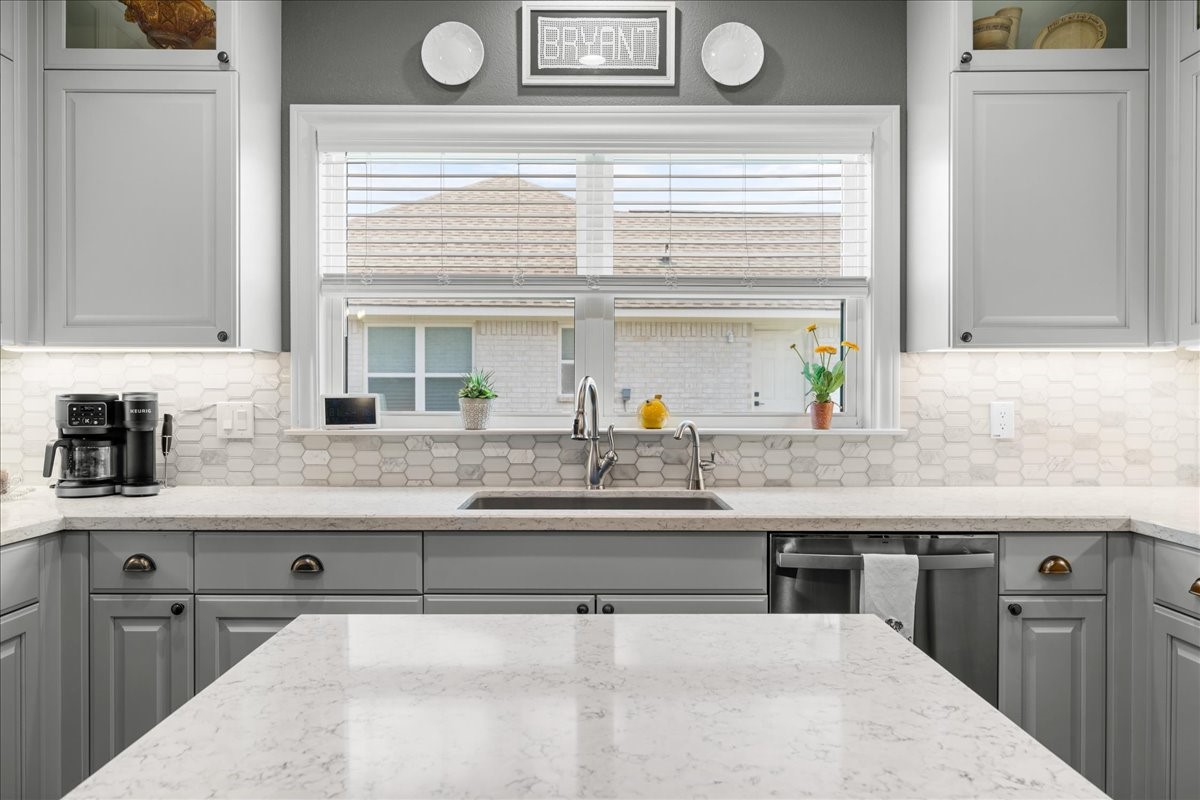 1207 Pecan Street Brenham, TX 77833 - Photo 7 of 29 a kitchen with granite countertop a sink and a stove