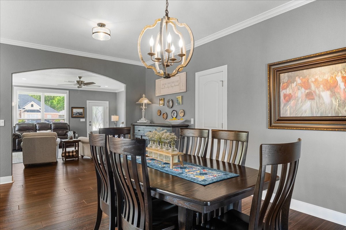 1207 Pecan Street Brenham, TX 77833 - Photo 10 of 29 a view of a dining room with furniture wooden floor and chandelier
