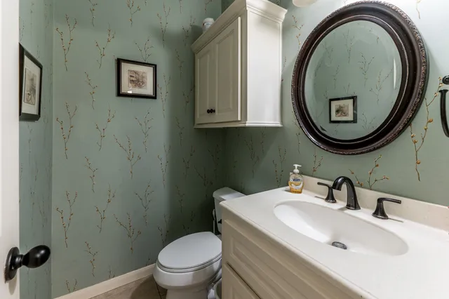 a kitchen with stainless steel appliances granite countertop a sink and a stove