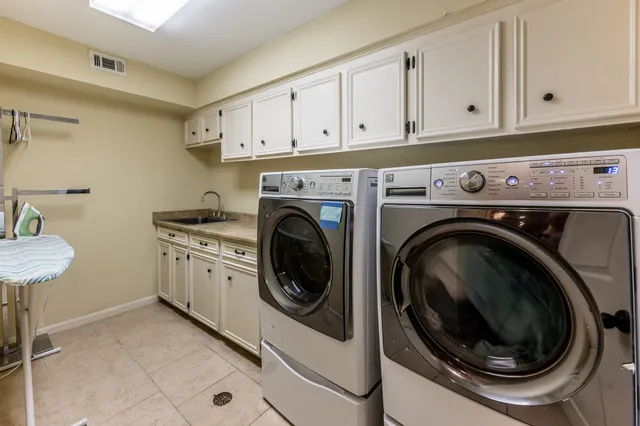 a bedroom with a bed furniture and a flat screen tv