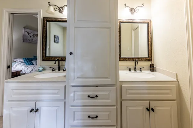a bathroom with a bathtub and a sink
