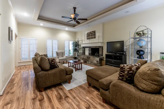 a living room with furniture a window and a table