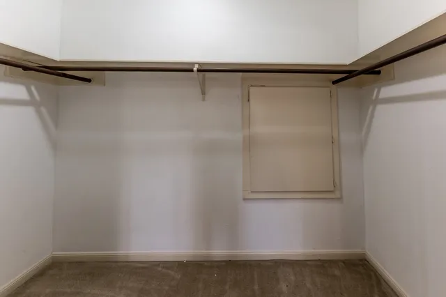 a bathroom with double vanity sinks and a mirror