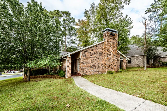 a view of a trees in front of a yard