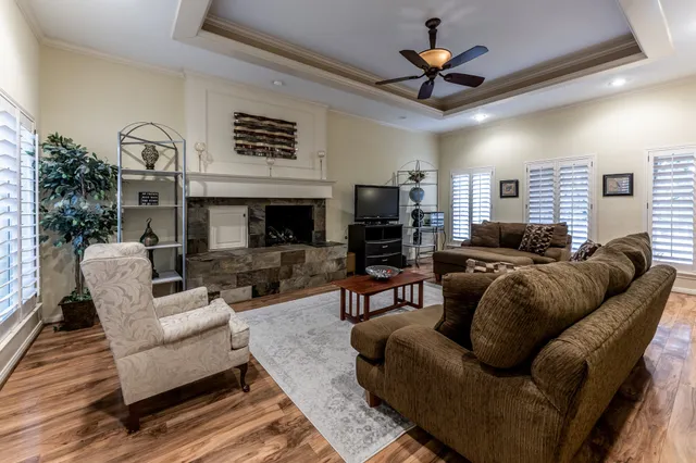 a view of a dining room with furniture wooden floor and chandelier