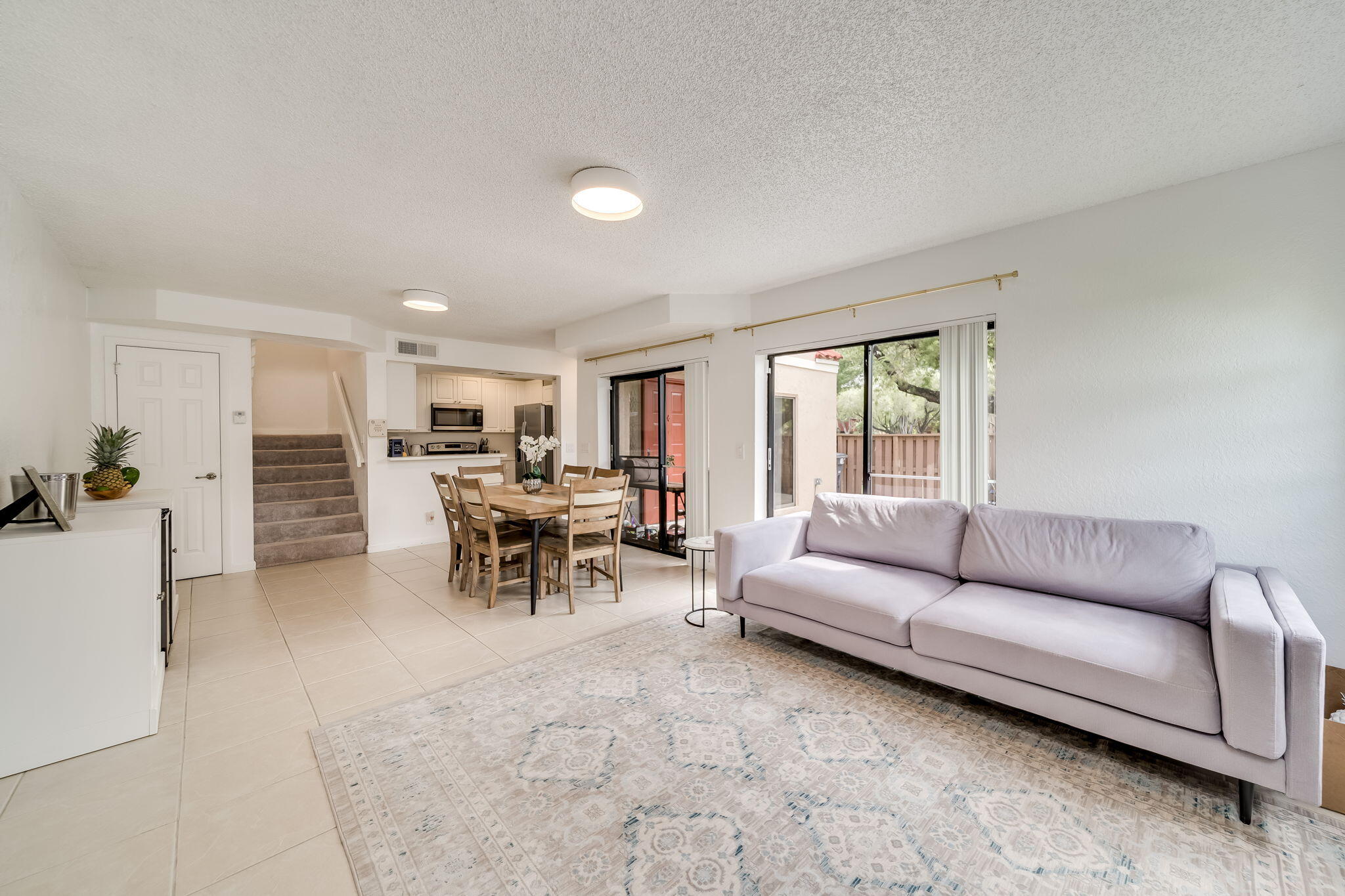 8116 Severn Drive, Unit C Boca Raton, FL 33433 - Photo 11 of 52 a living room with furniture and a large window