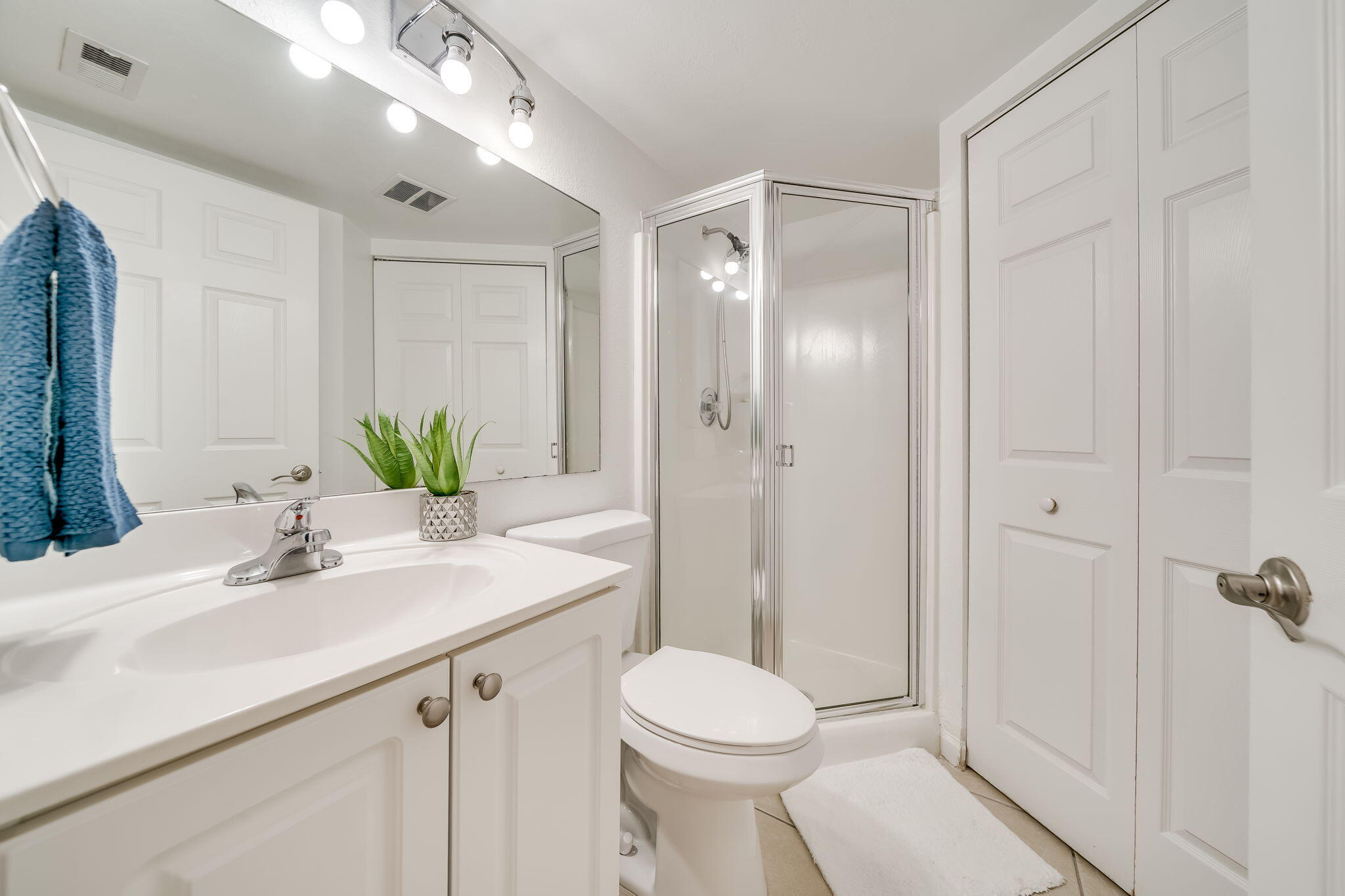 8116 Severn Drive, Unit C Boca Raton, FL 33433 - Photo 14 of 52 a bathroom with a sink toilet and shower